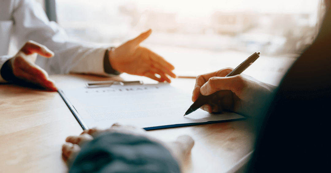 Vendor and Client Discussing Contract Value Before Signing It